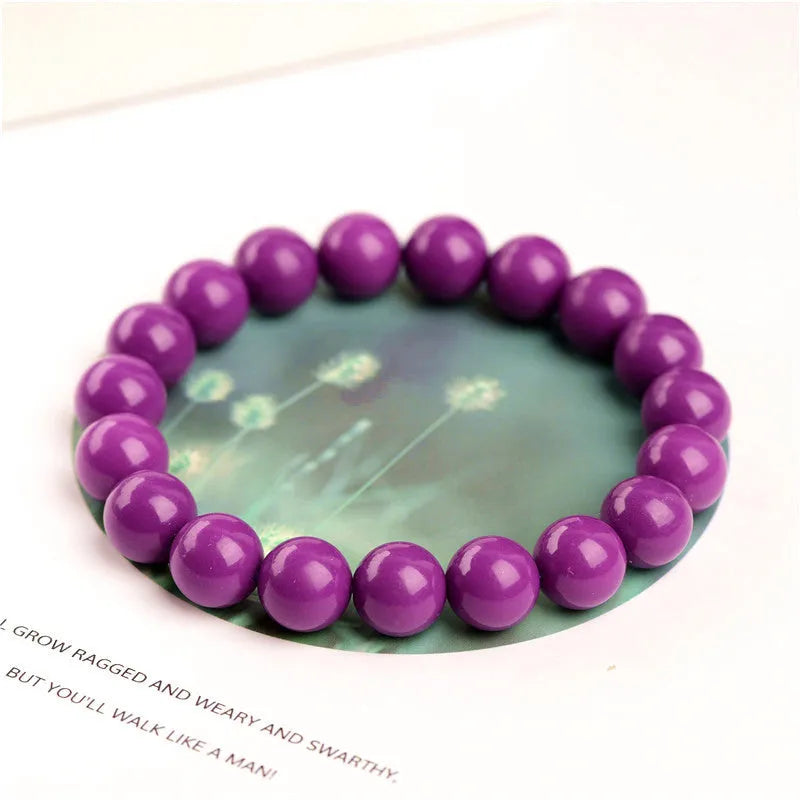 Jiuya polished purple mica crystal bracelet in a single circle design on a wrist.