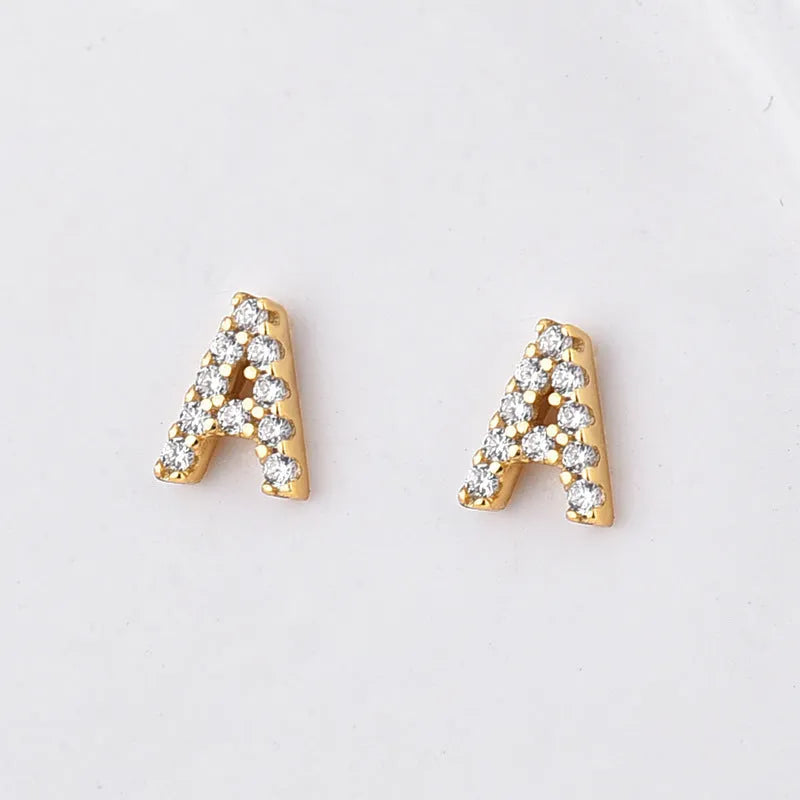 Gold plated alphabet letter stud earrings with zircon stones showing A to Z selection on copper base