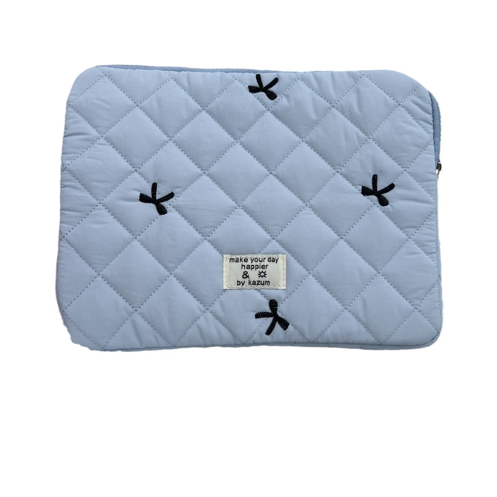 Nylon laptop storage bag with embroidered rhombus and bow design in light blue.