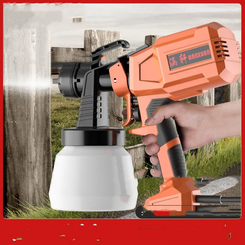 Electric watering can spray gun with plastic body and split aluminium pot on a table