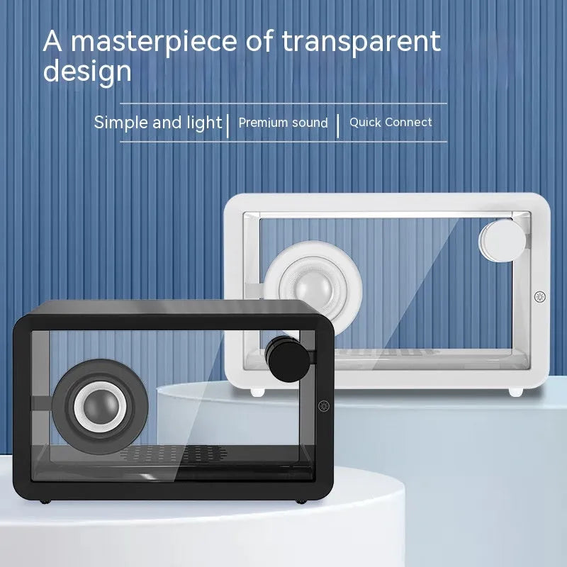 Transparent glass creative Bluetooth speaker in black on a desk with USB cable nearby