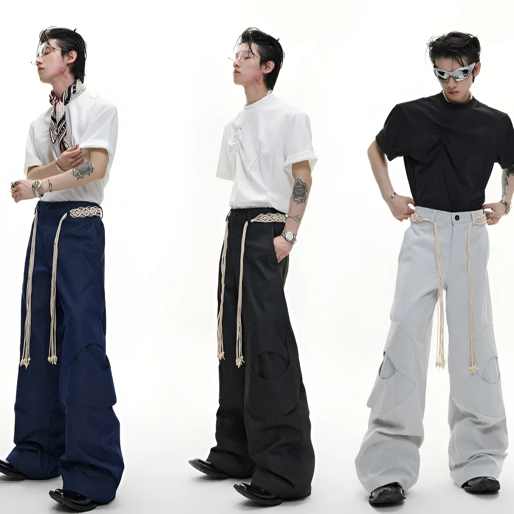 Men's dark blue straight-leg trousers with 3D cutting, zipper decorations, and a tassel pocket detail on a micro-elastic cotton fabric.