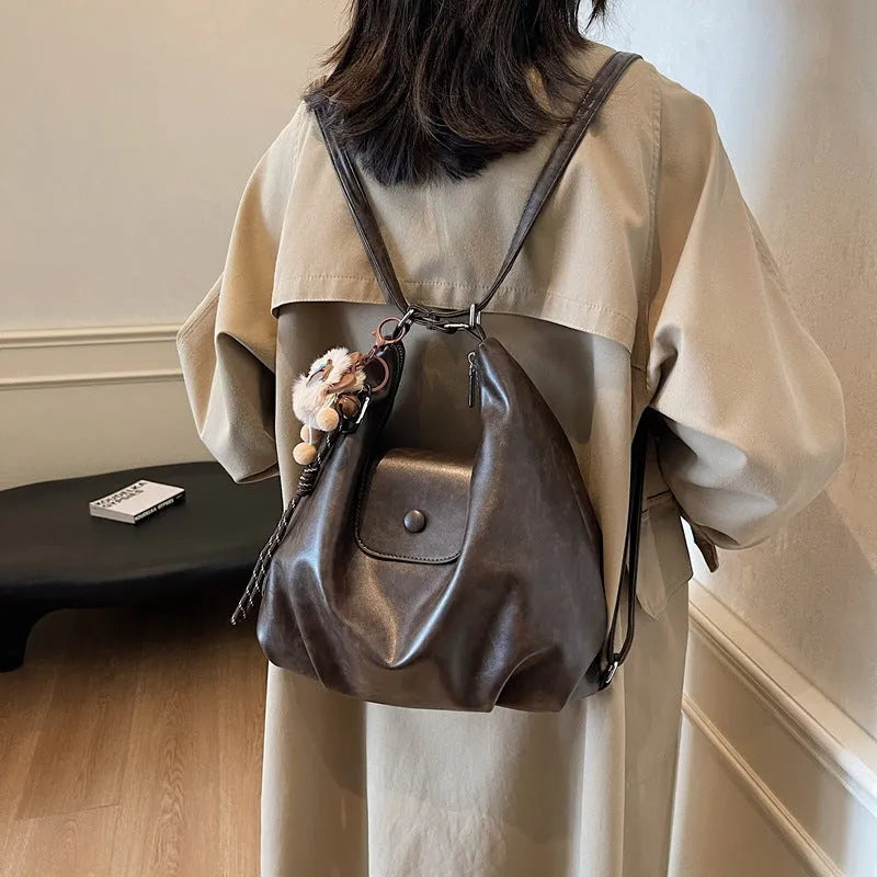 Leather women's shoulder bag in brown colour with single strap and structured horizontal design