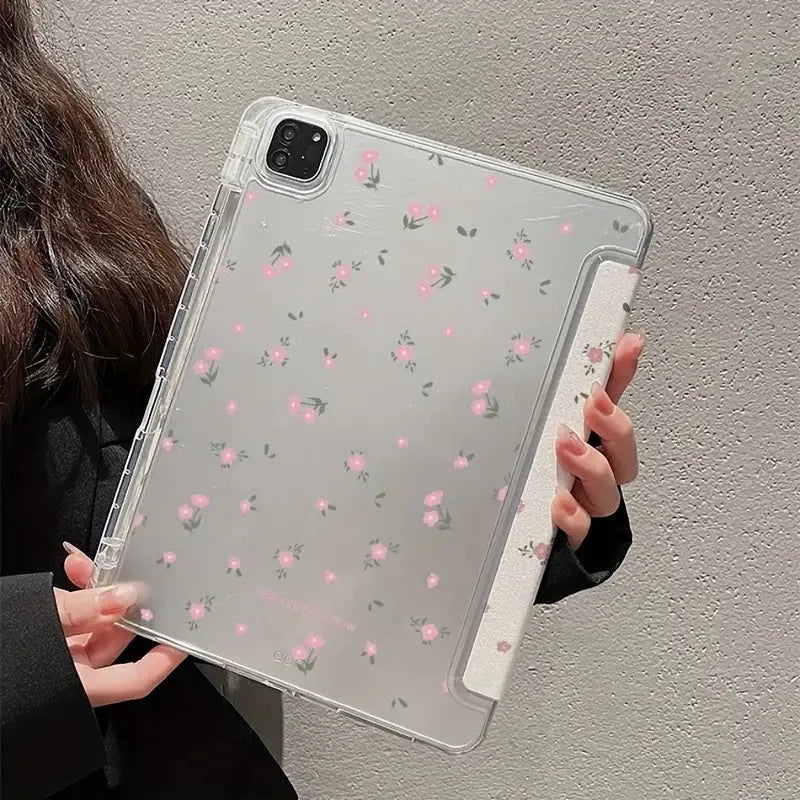 Transparent floral patterned tri-fold protective case for Apple iPad in stand position.