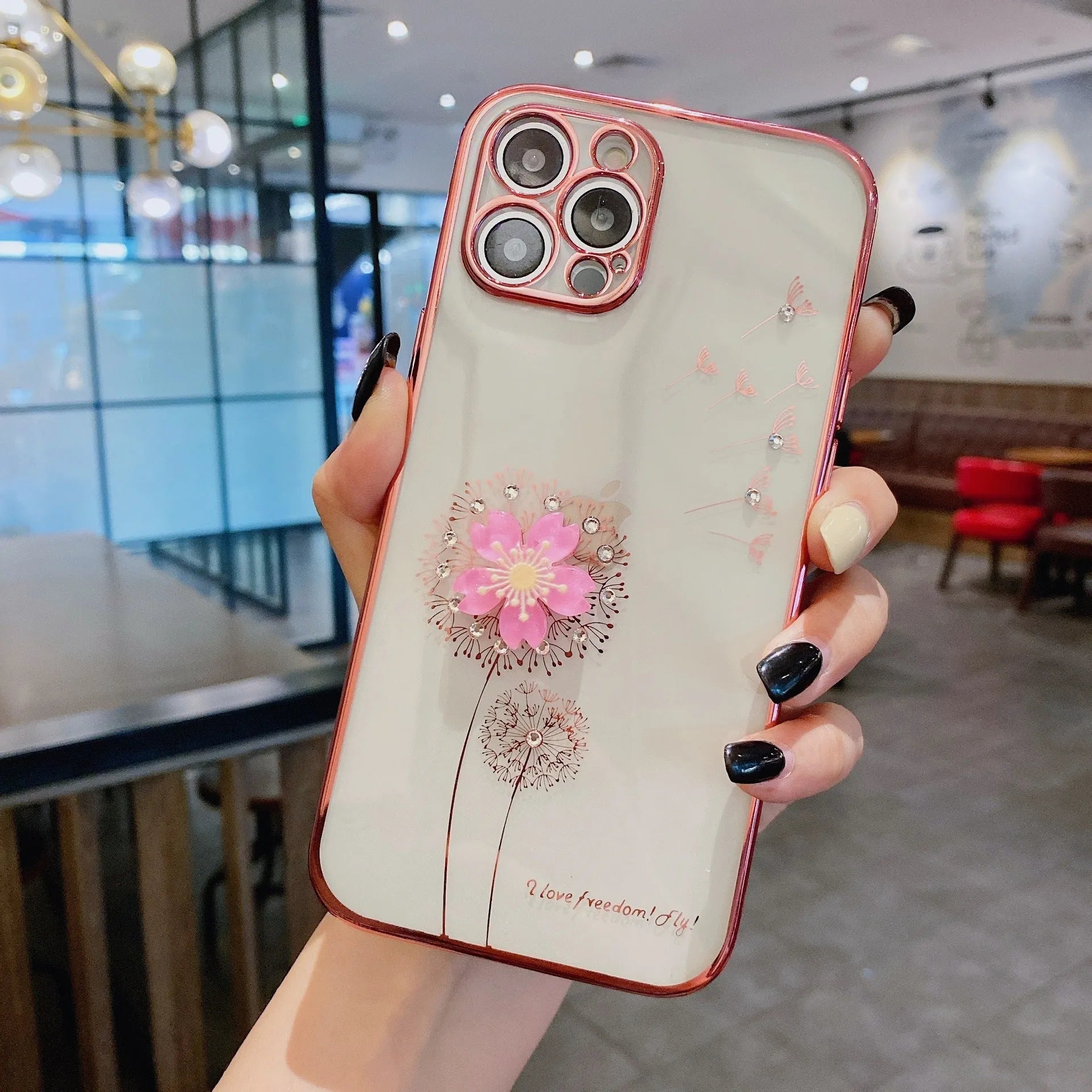 Green iPhone case with 3D flower spin stand and built-in screen protector shown on iPhone 13