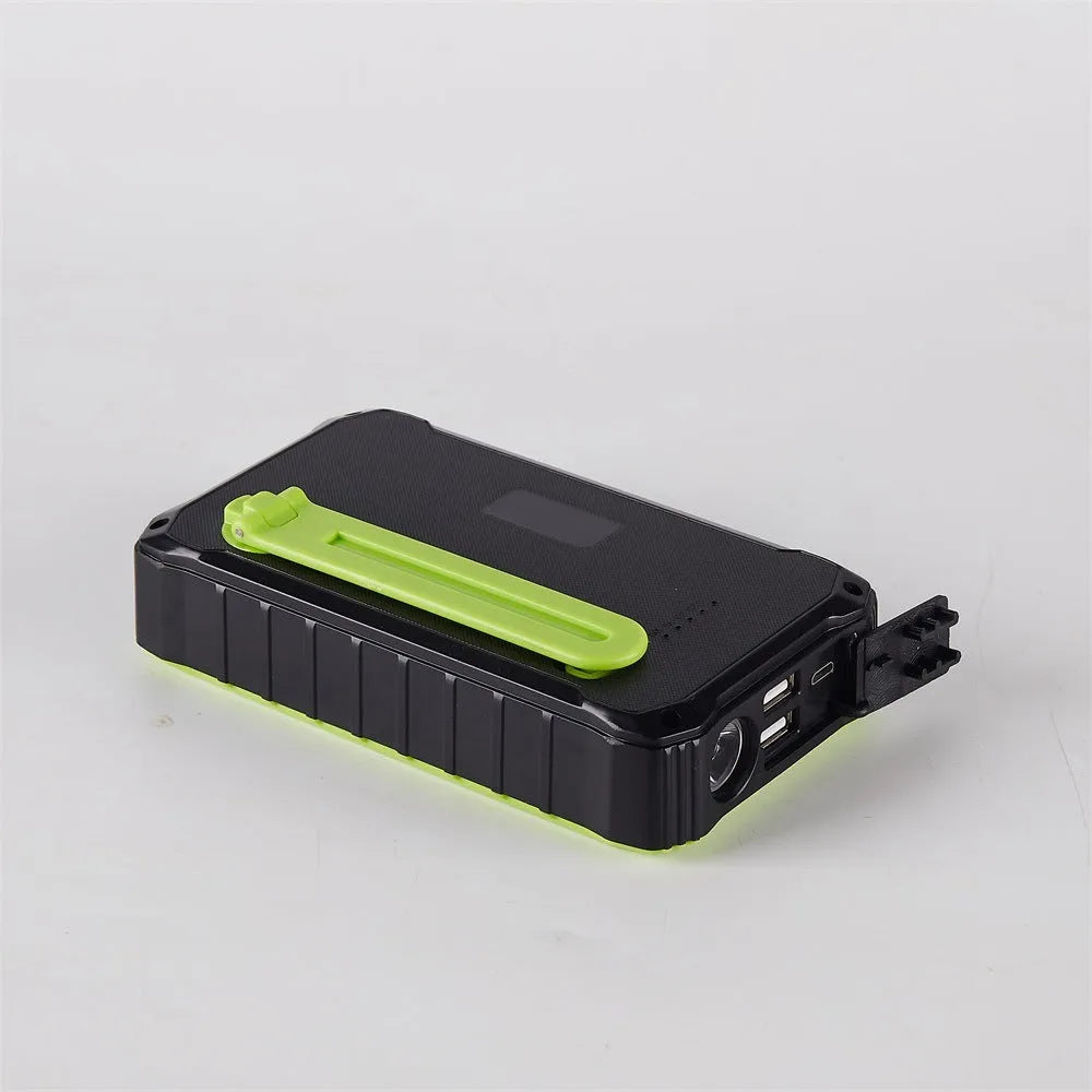 Green or orange hand solar mobile power bank showing dual USB ports and solar panel