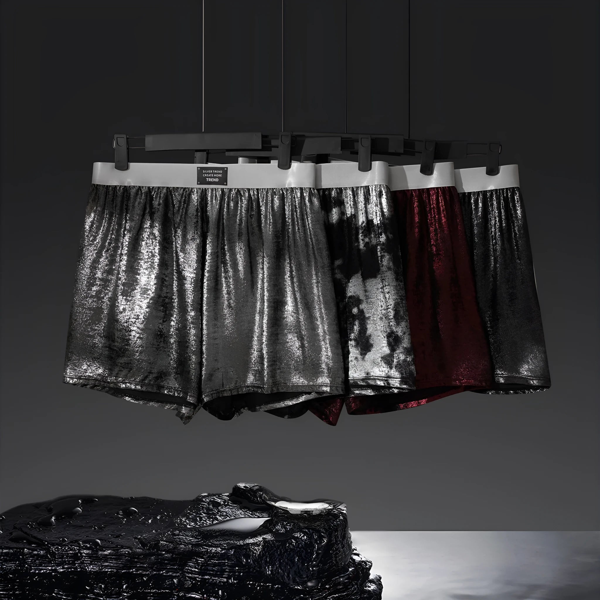 Galaxy brand men's reflective silver loose sports underwear on a mid-waist model.