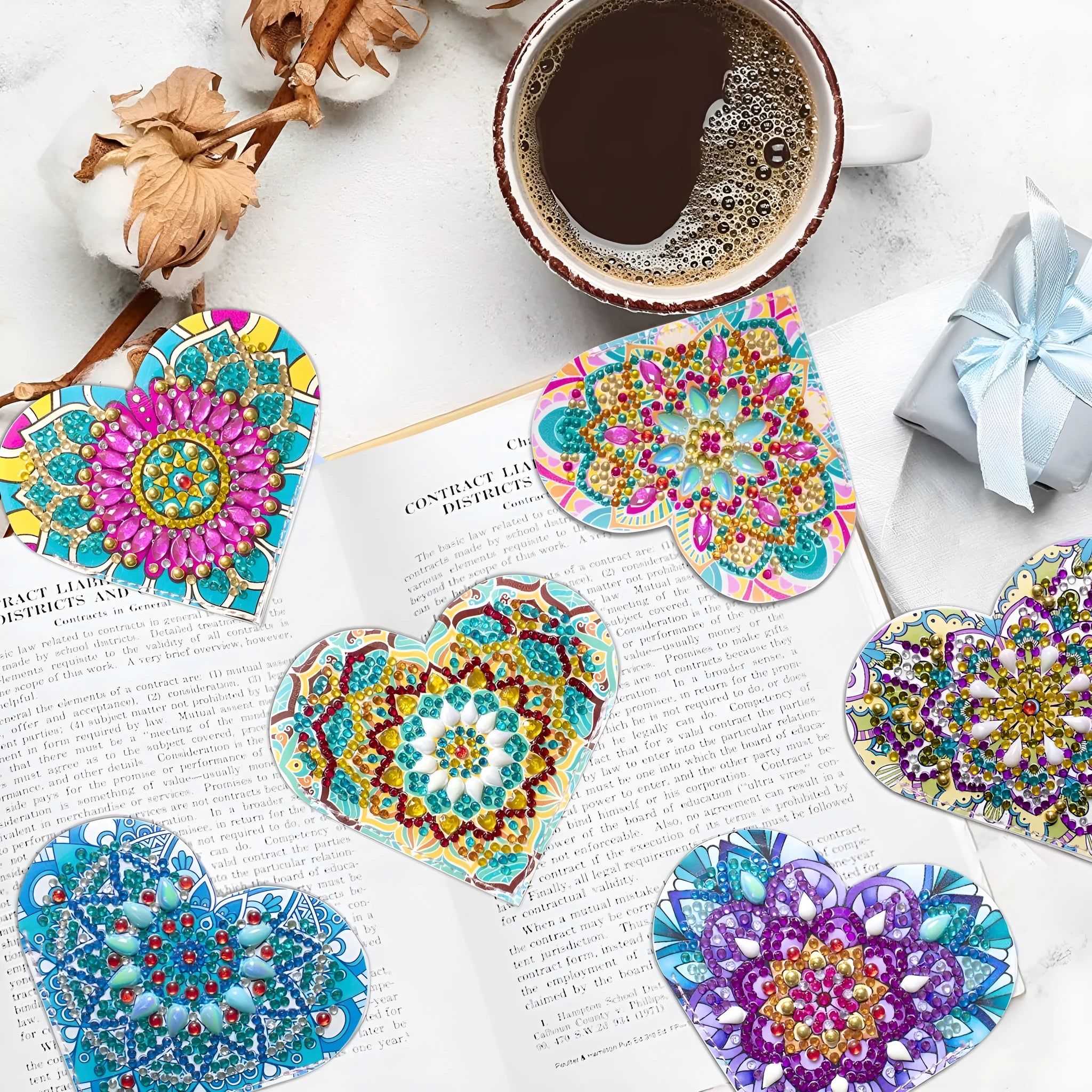 Six handmade PU leather bookmarks with crystal and floral corner designs on a book.