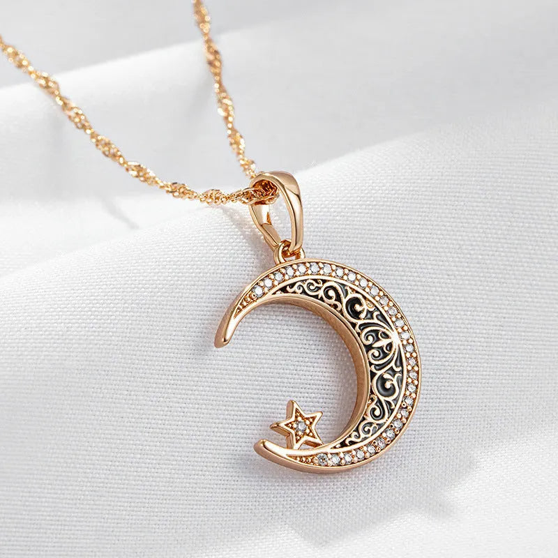 Rose gold star moon pendant necklace with zircon crystals and enamel detailing on water wave chain