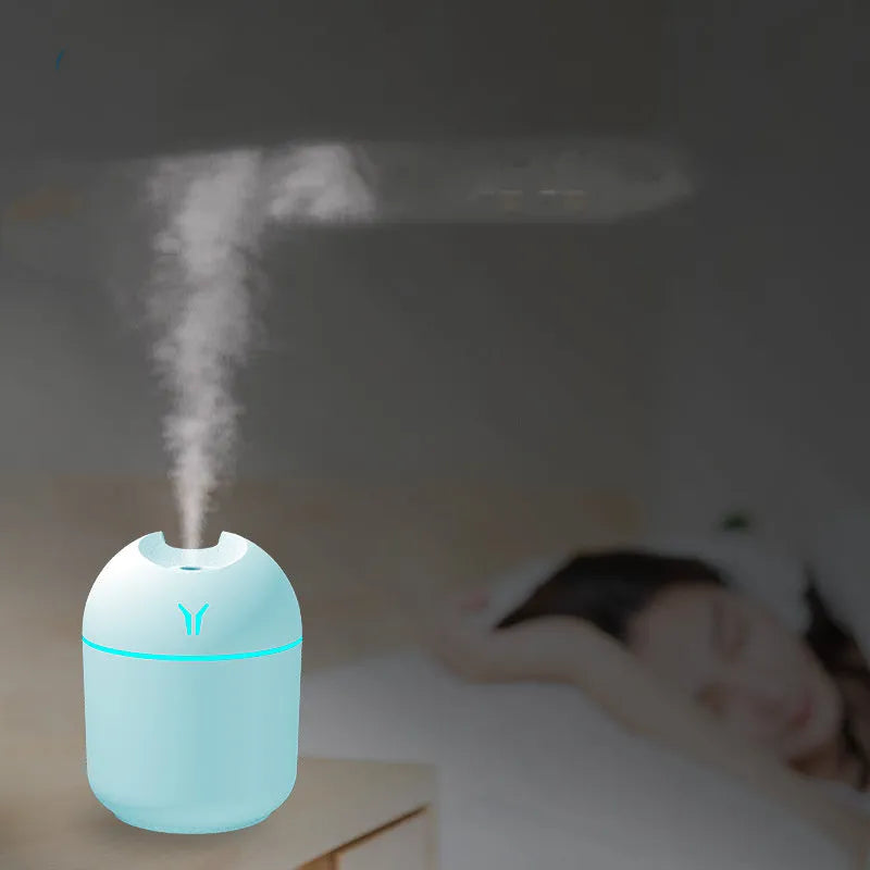 Round desktop humidifier with USB cable in ivory white, sky blue, or girlish pink colours