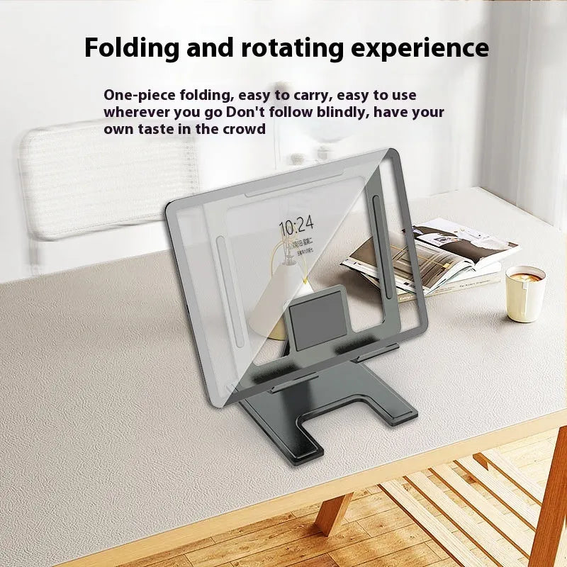 Flat black metal foldable notebook bracket with rotating base on a wooden desk