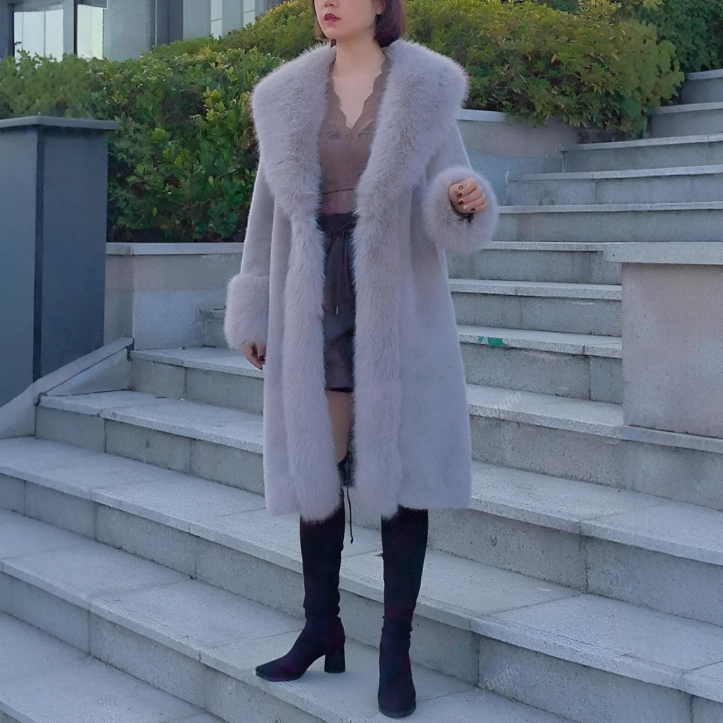 A grey women's mid-length coat with thick faux rabbit fur and a matching fur collar.