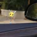 Soft fur bee car decoration on a swing spring for dashboard personalisation.