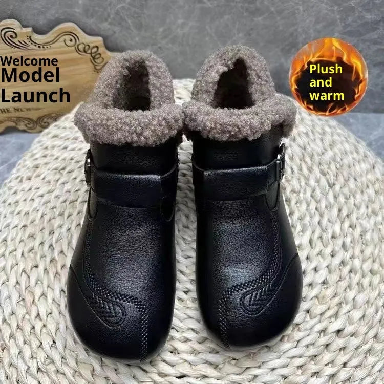 Winter slip-on ankle boots for women in black synthetic leather with low platform heel and round toe