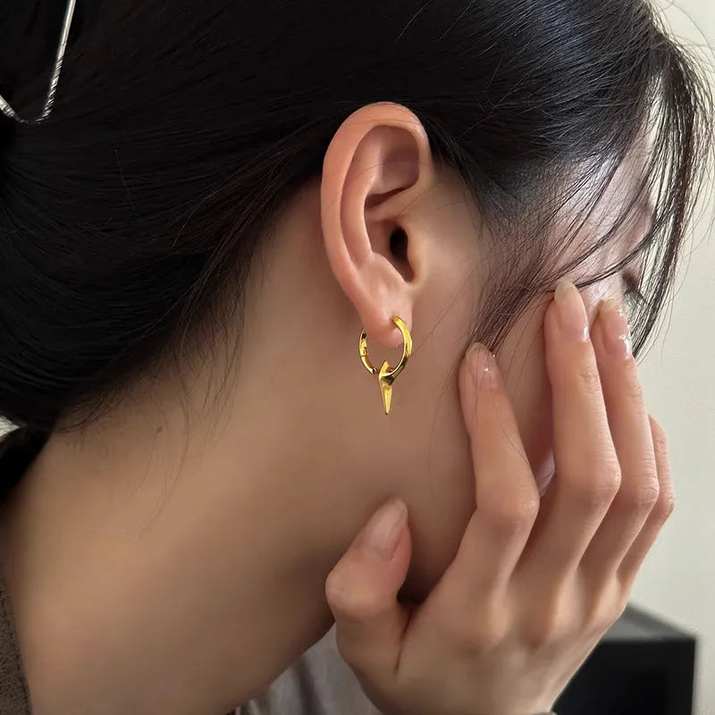 Geometric star-shaped women's ear clips in a platinum colour with a clip-on fastening.
