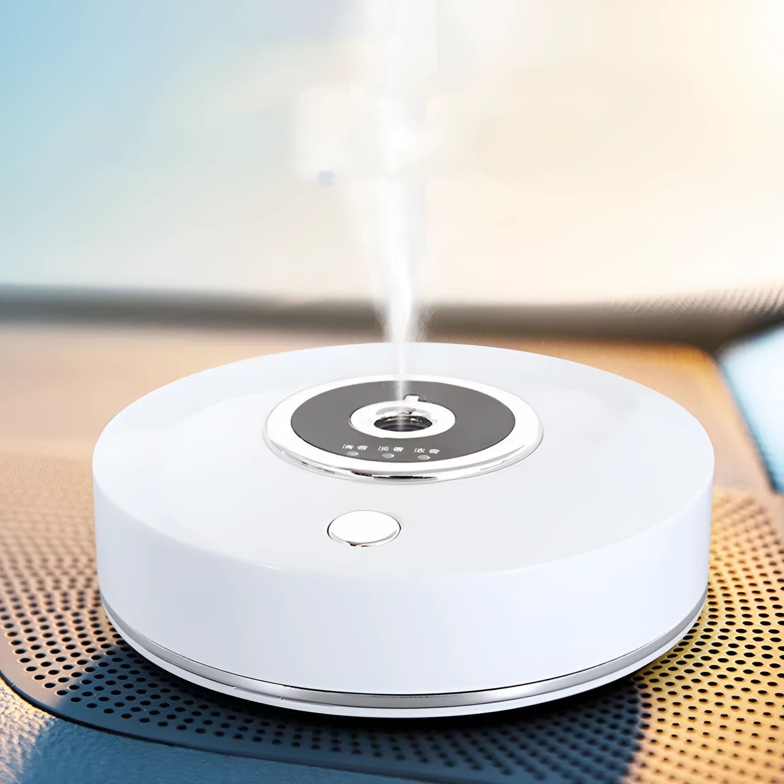 White plastic USB car aromatherapy machine with anti-slip pad on vehicle dashboard