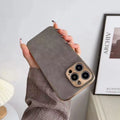 Leather texture TPU phone case for iPhone in solid grey, black, blue, or grey-green colour.