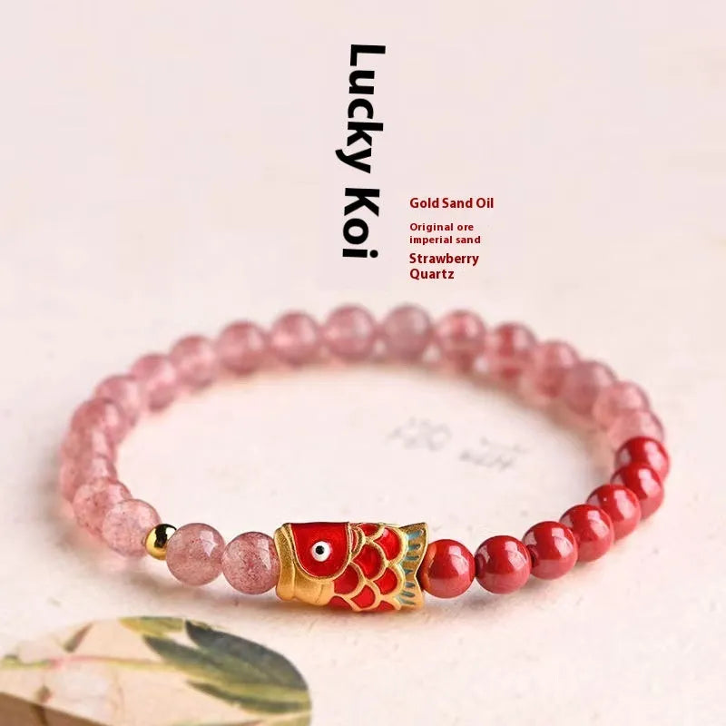 Women's retro bracelet with purple cinnabar and pink strawberry quartz beads on a wrist.