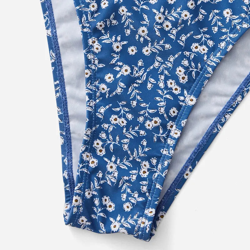 Blue polyester swimsuit three-piece set without steel rings showing separate top and shorts components