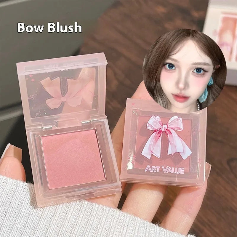 Butterfly box makeup set containing four matte lip muds, powder blusher, and coordinating necklace