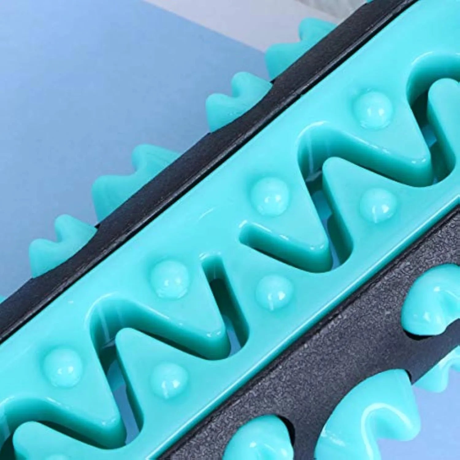 Natural rubber dog toothbrush chew toy in blue colour for dental cleaning.