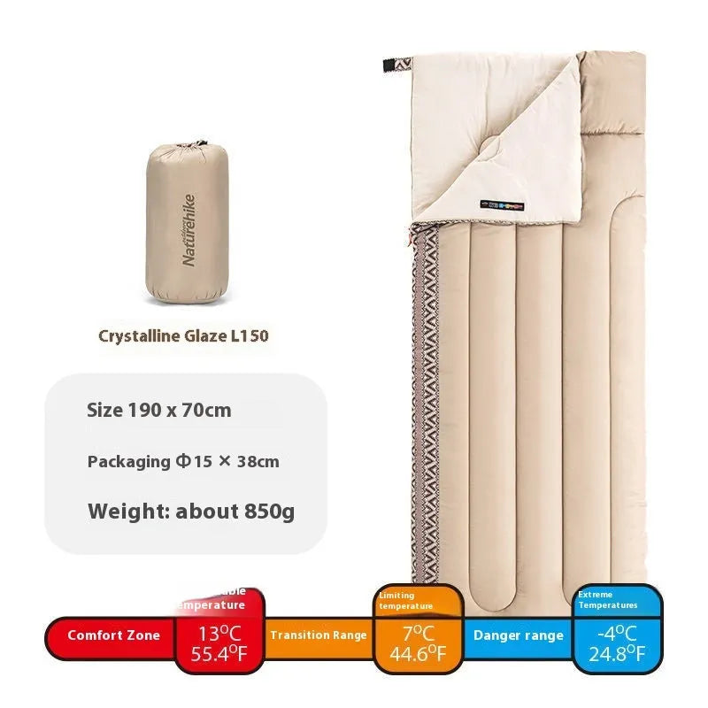 Four seasons portable camping sleeping bag in swamp colour with storage bag.