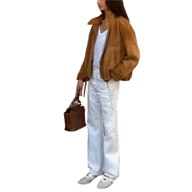 Retro-style loose-fit solid colour jacket with long sleeves on a hanger.