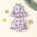 White toddler boy two-piece swimsuit set with shirt and beach shorts on a hanger