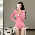 Women's long sleeve one-piece swimsuit in pink and black colours