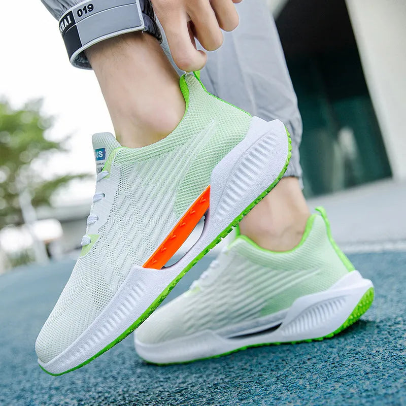 Men's blue casual sports shoes with breathable mesh cloth upper and round toe on a plain background.