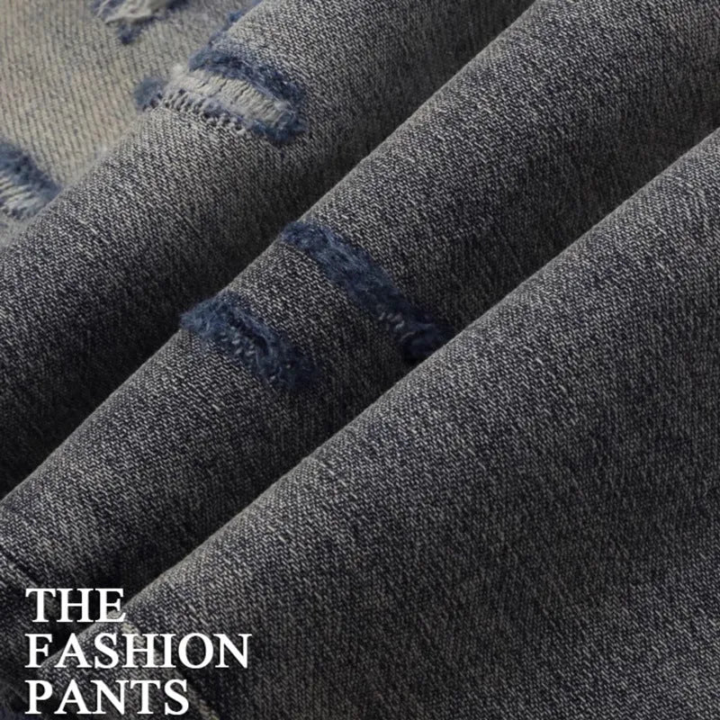 Slim fit jeans in washed-out old colour with patch embroidery detail on the leg.