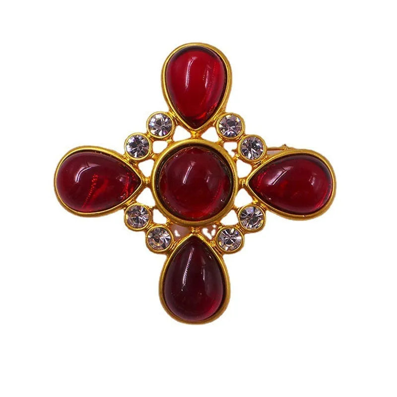 Close-up of a medieval-style baroque cross brooch with crystals, made from zinc alloy in a vintage colour finish.