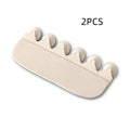 White PVC toilet training splash guard placed on a toilet seat.