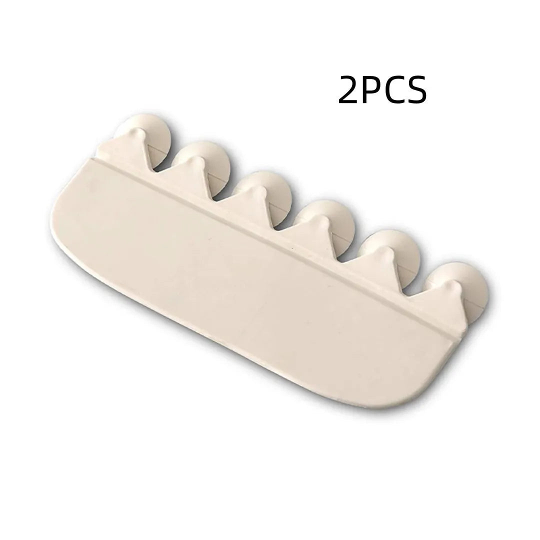 White PVC toilet training splash guard placed on a toilet seat.