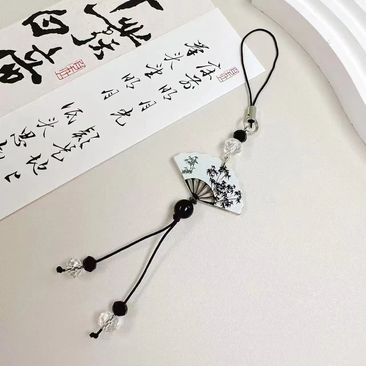 Chinese style pendant keychain with bead design in Fan or Poetry options for schoolbag decoration.