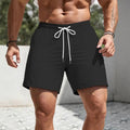 Men's loose-fit polyester sports shorts in straight-leg style on a hanger