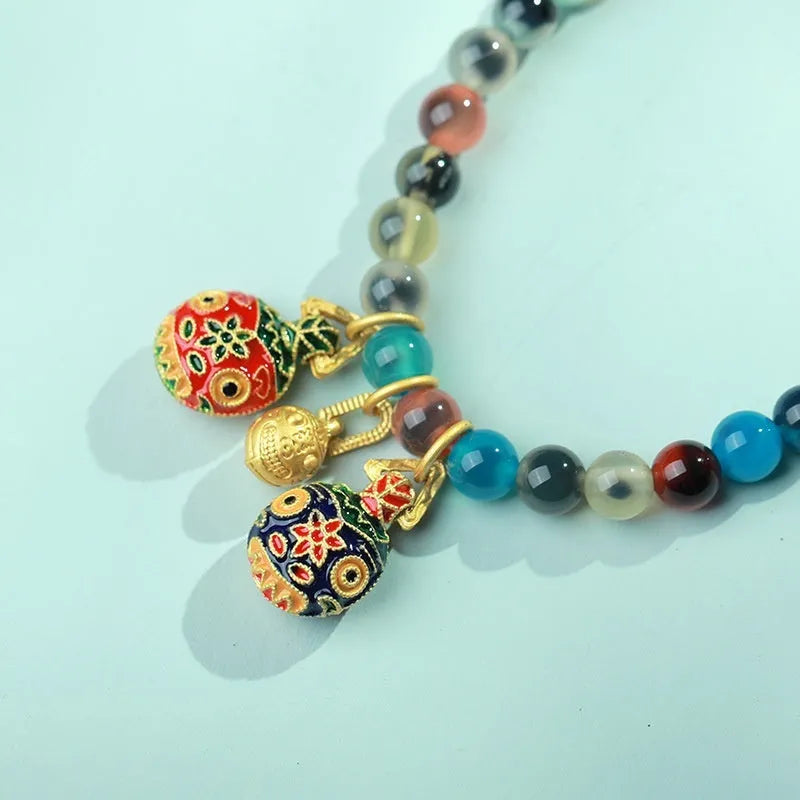 Women's agate bracelet with natural colourful sugar heart design and copper coin snake detailing