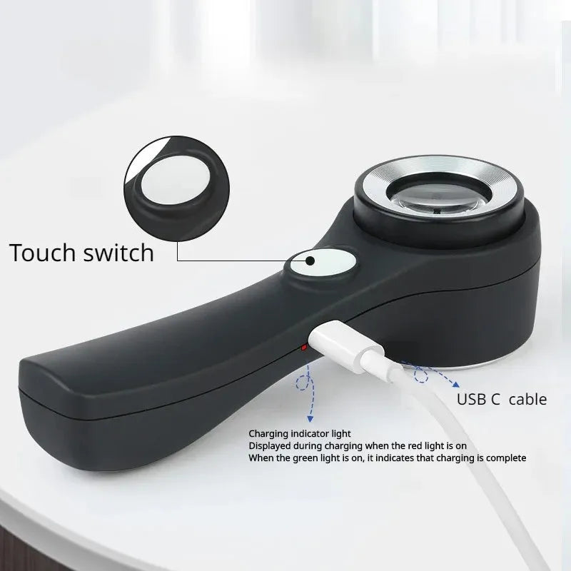Black and silver metal jewellery appraisal magnifying glass with optical glass lens and USB-C cable.