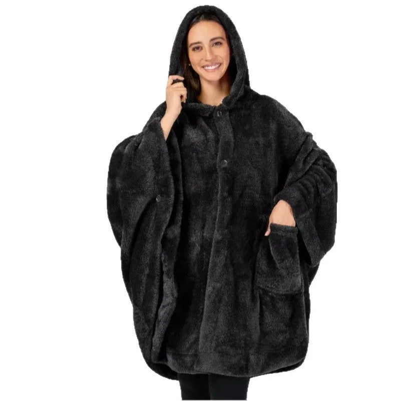 A thick pink hooded bathrobe with long sleeves and a cardigan-style front, laid flat.