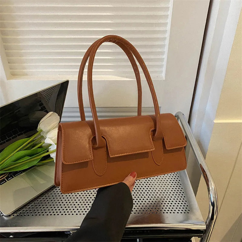Women's black PU leather square handbag with single shoulder strap and stitching detail