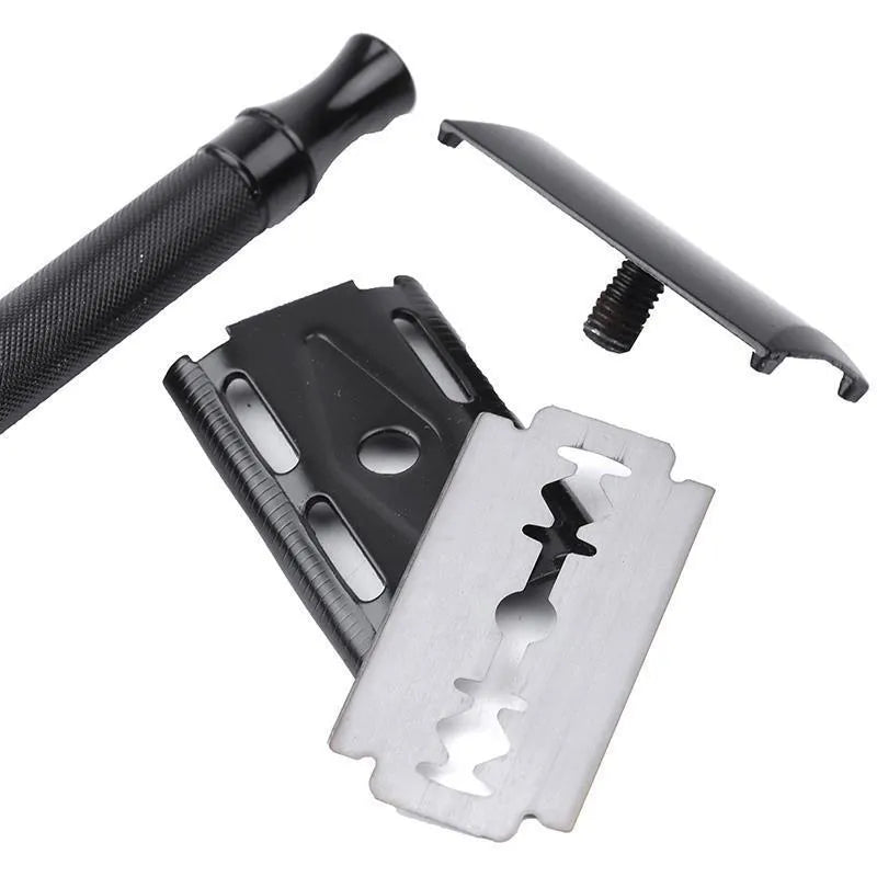 Traditional manual shaving razor with brush set on a black or silver handle