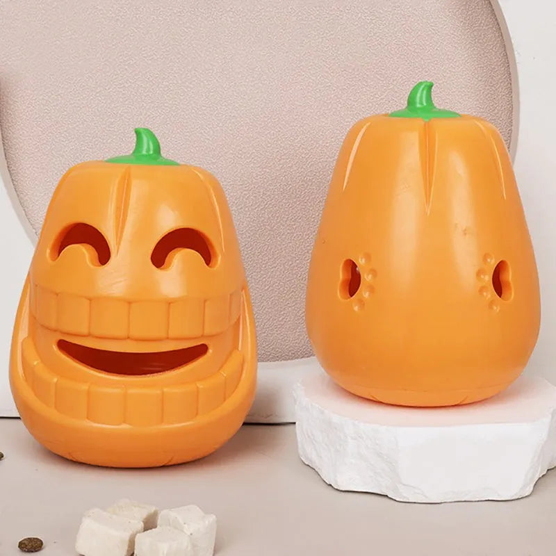 Orange Halloween pumpkin shaped rubber dog toy with a hollow centre for treats.