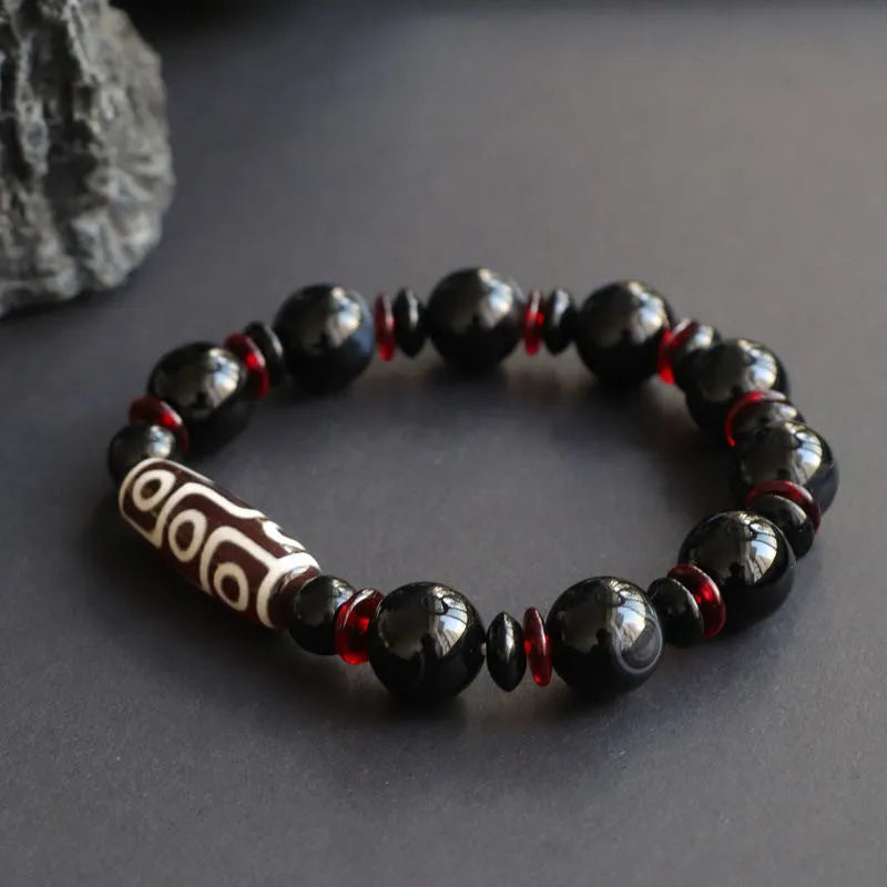 Black agate dzi bead bracelet with chalcedony stones and hand-woven design