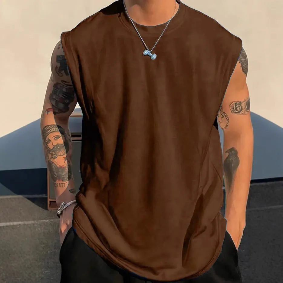 Men's loose fit cotton sleeveless t-shirt in a solid colour, shown on a hanger.