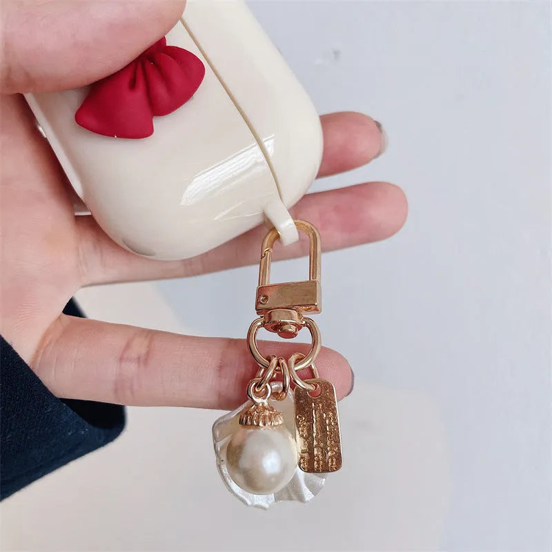 Beige red bow shell wireless earphone case for AirPods models with TPU clamshell design