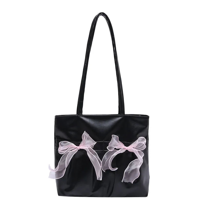 College style black bow tote bag with double shoulder straps showing interior zippered pocket