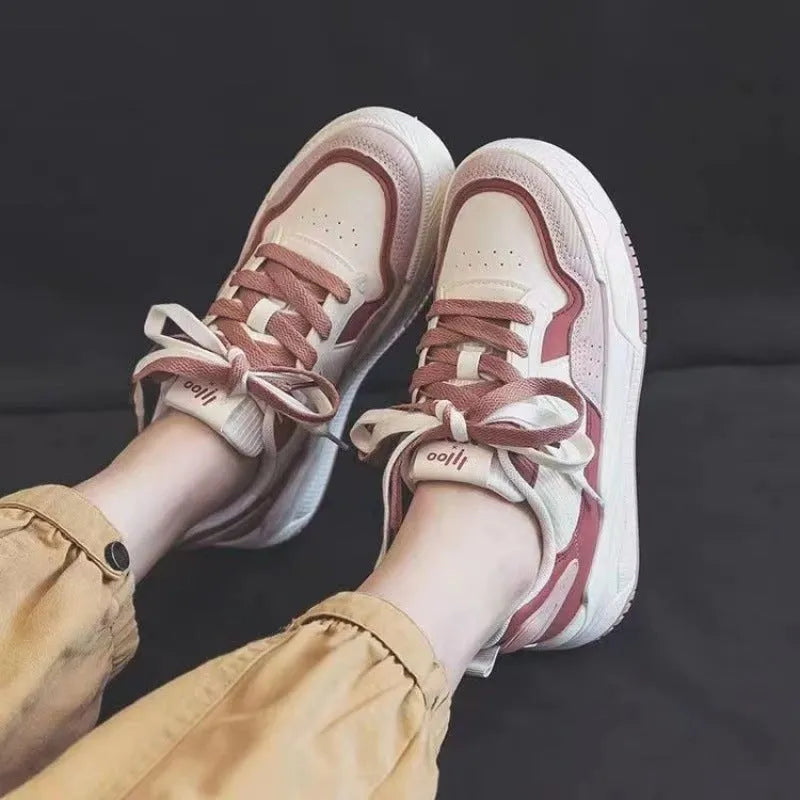 Low top rubber sneakers in pink and milky white with height-increasing design