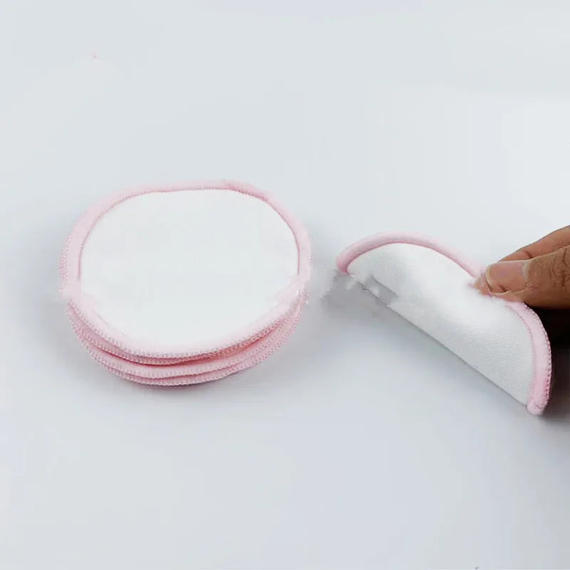 Velvet makeup remover pad in water pink and light blue colours showing bamboo polyester blend texture
