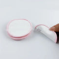 Velvet makeup remover pad in water pink and light blue colours showing bamboo polyester blend texture