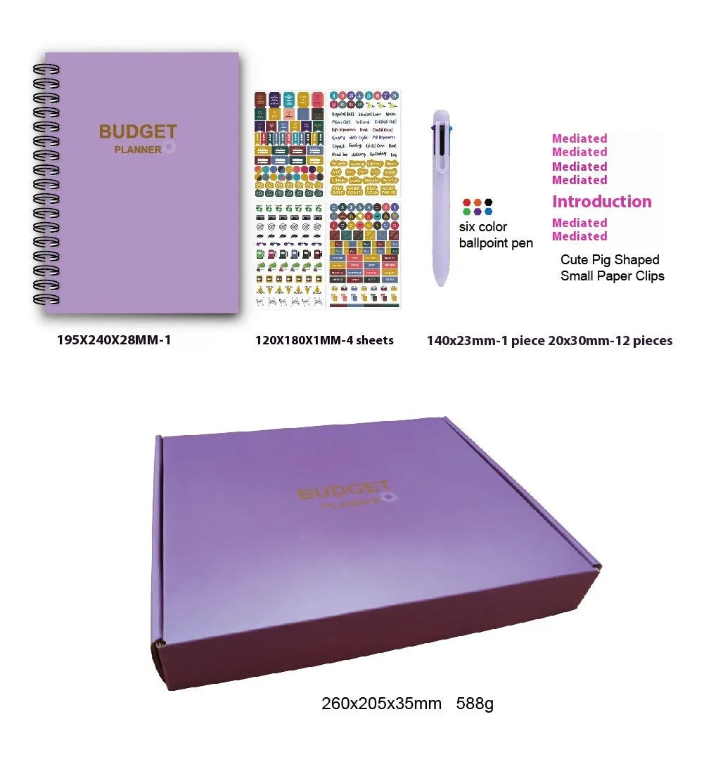 J12 purple coil-bound budget notebook with financial planning stickers and paper clips laid out.